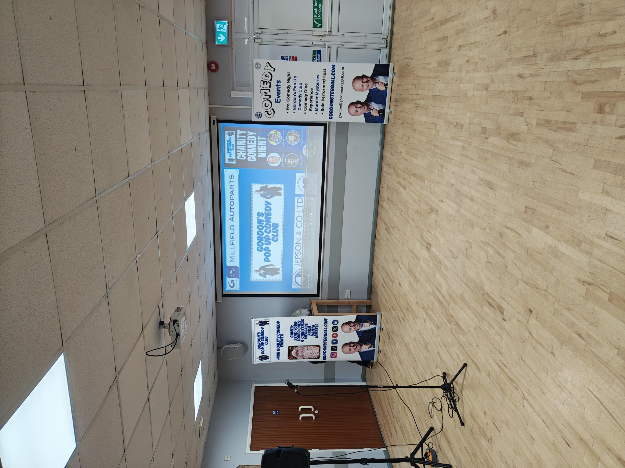 Stage and microphone set up for the comedy night.